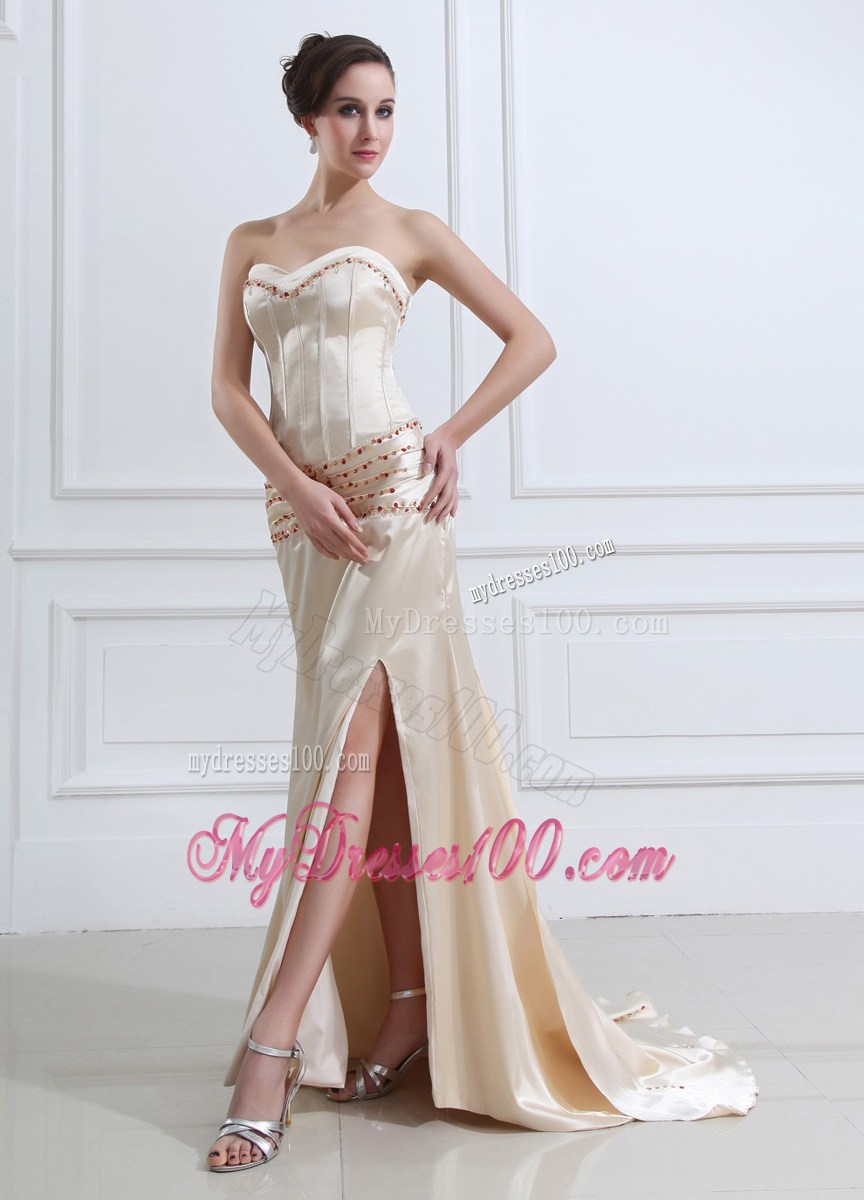 Elegant Brush Train Champagne Prom Dress with Red Beading and High Slit