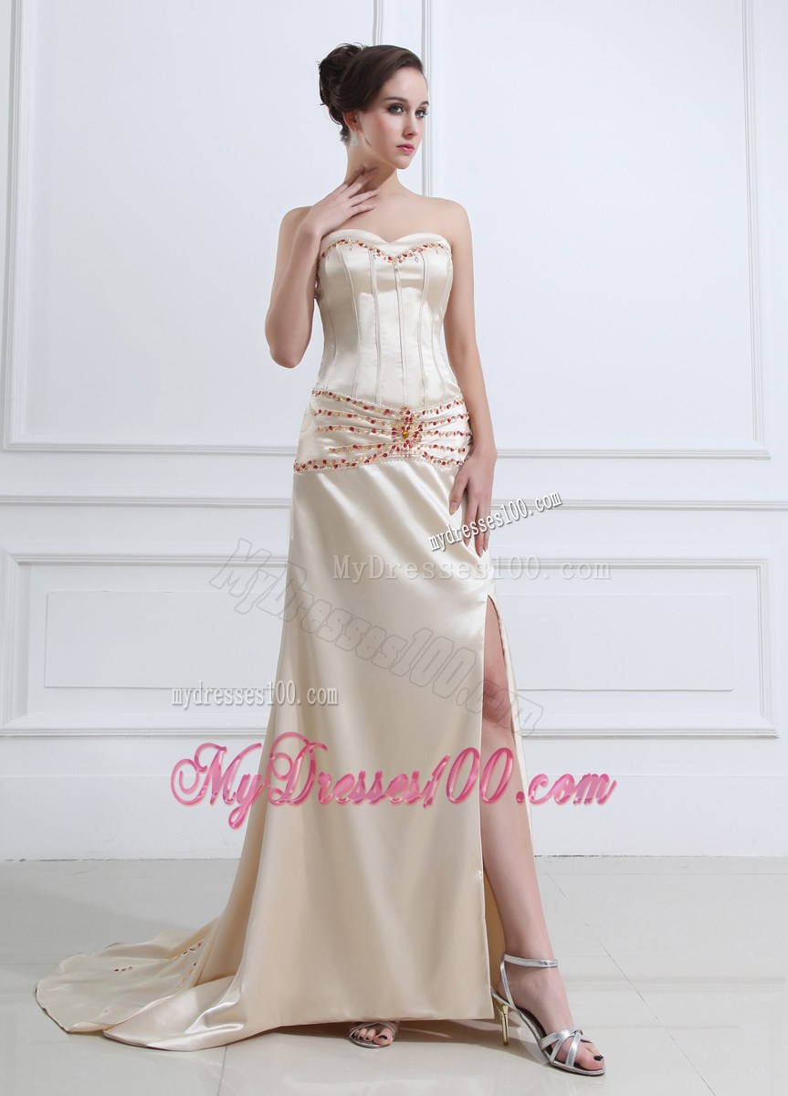 Elegant Brush Train Champagne Prom Dress with Red Beading and High Slit